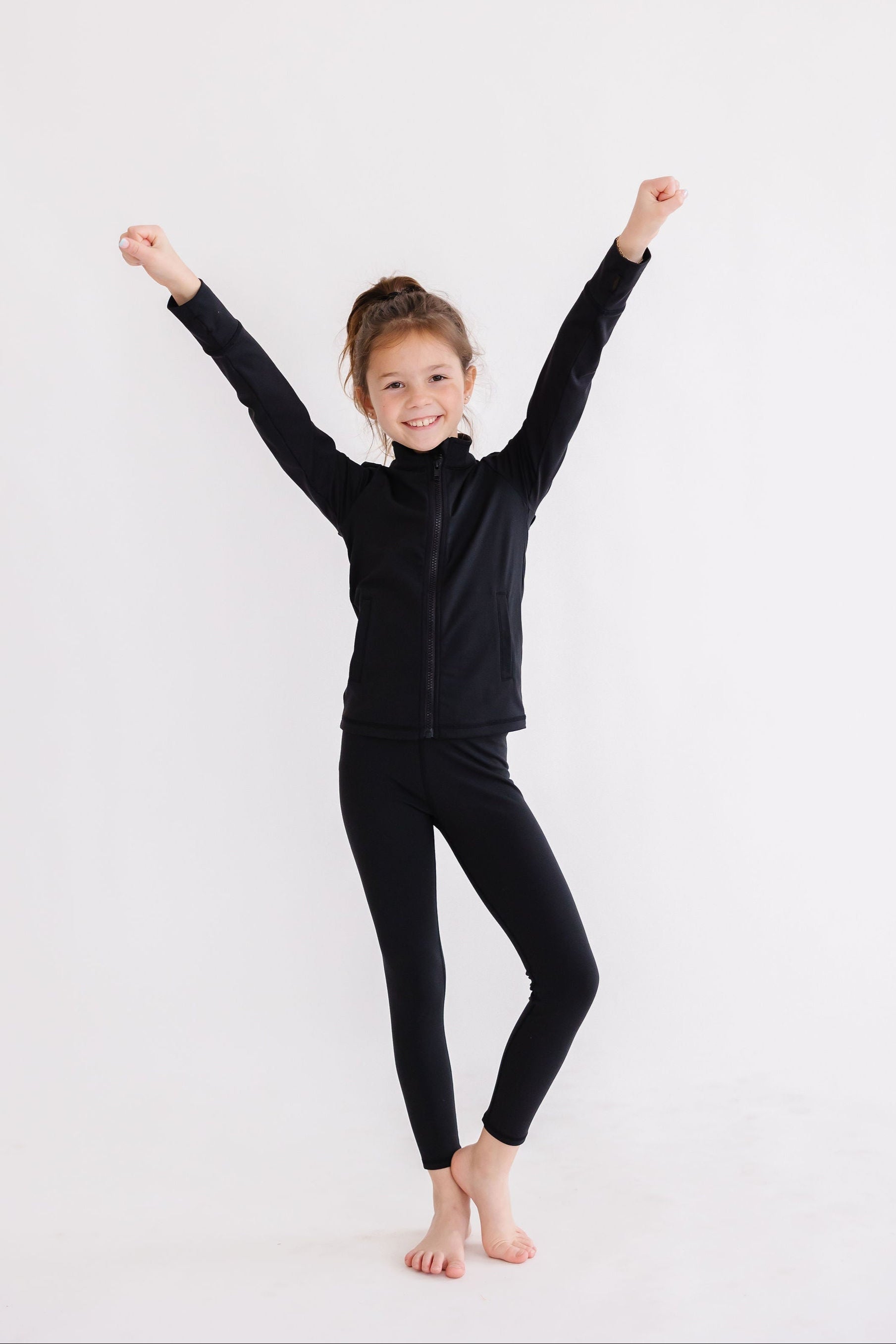Veste active zippée à volants noir équilibré