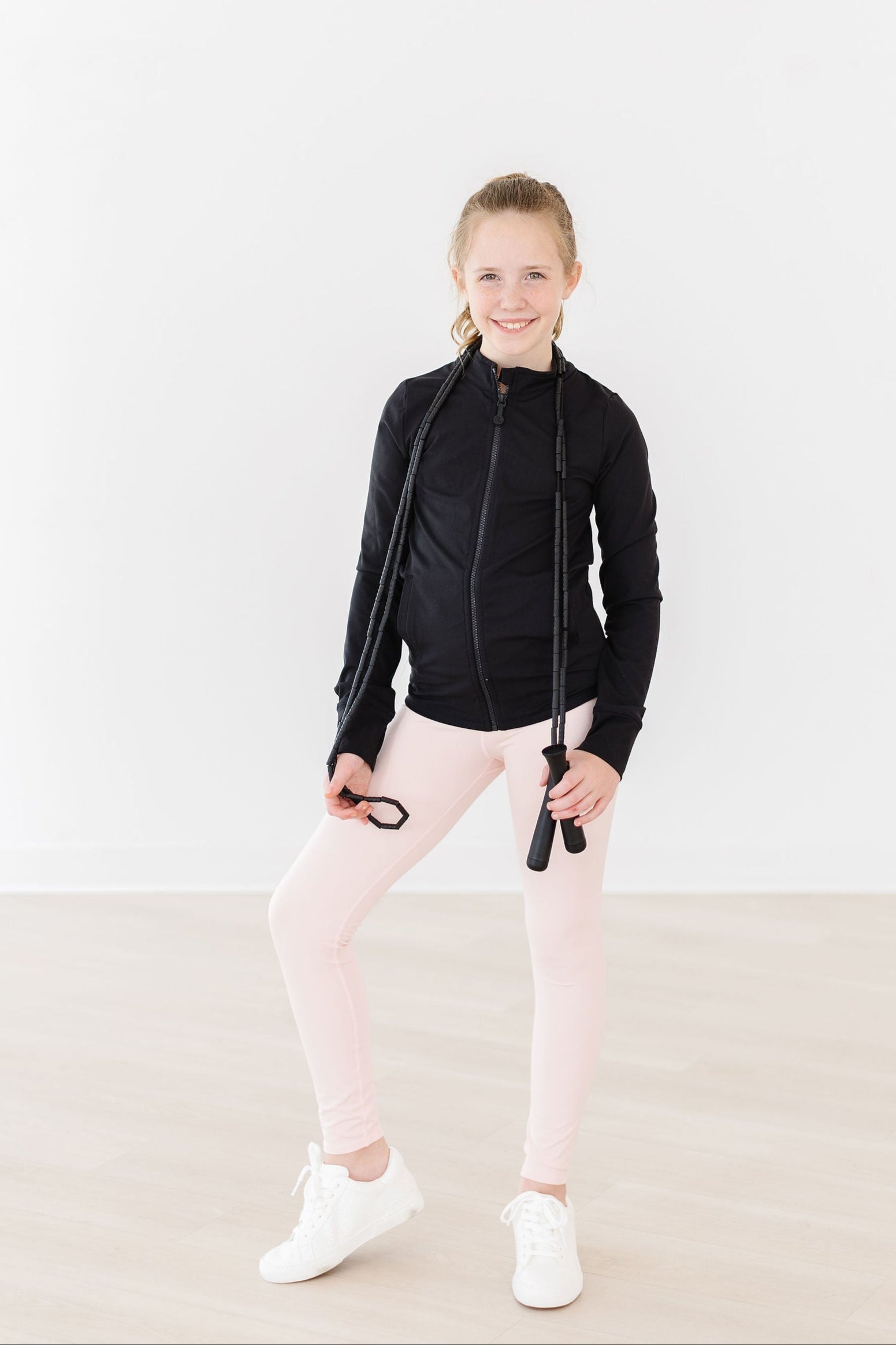 Veste active zippée à volants noir équilibré