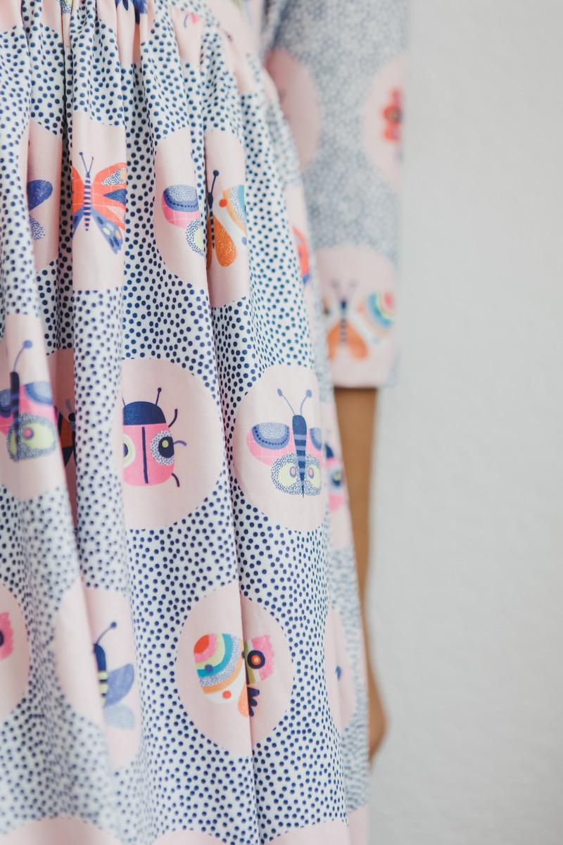 Robe virevoltante à manches 3/4 et poches Papillon