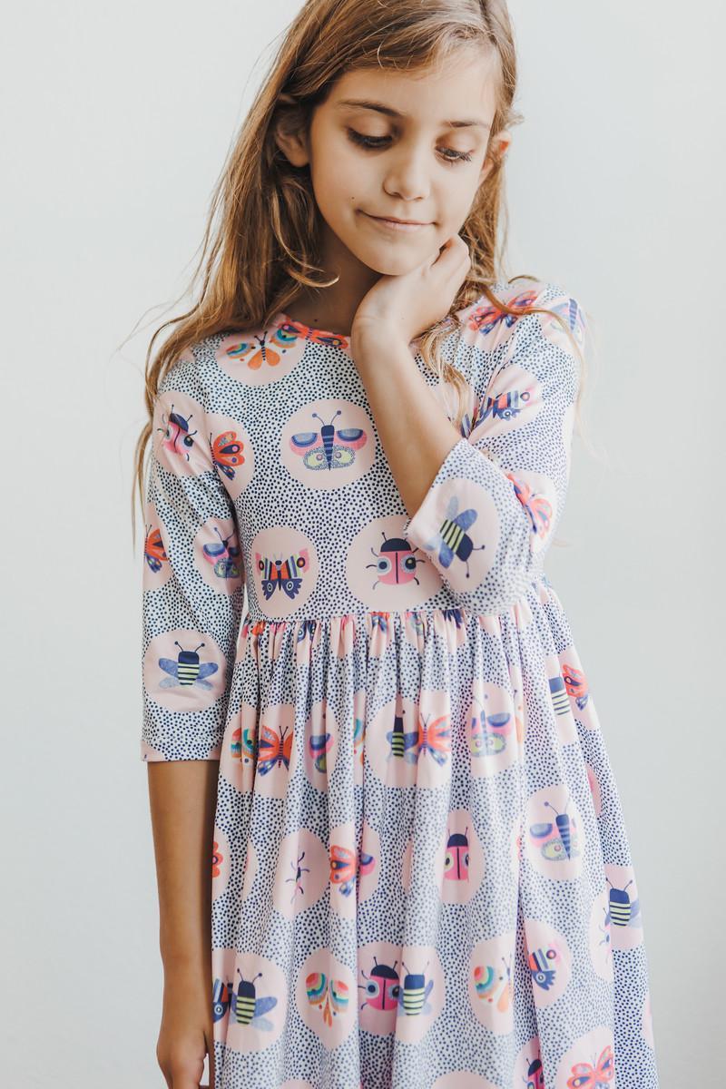 Robe virevoltante à manches 3/4 et poches Papillon