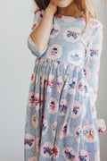 Robe virevoltante à manches 3/4 et poches Papillon