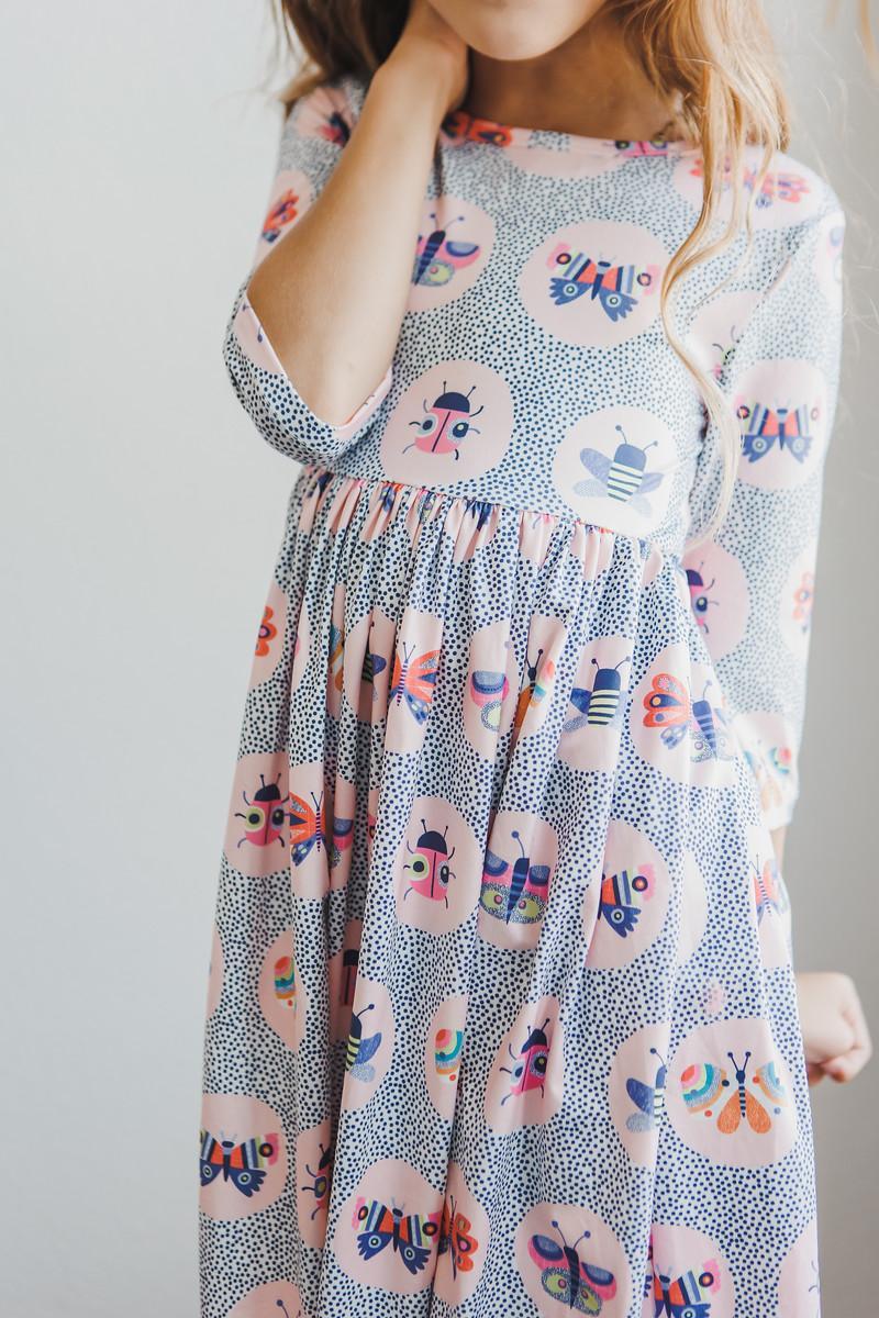 Robe virevoltante à manches 3/4 et poches Papillon