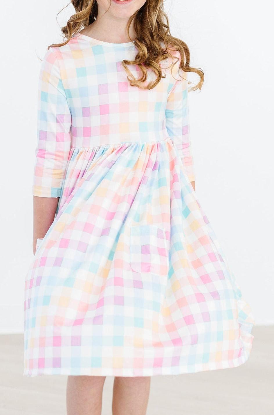 Robe virevoltante à carreaux pastel, manches 3/4 et poches
