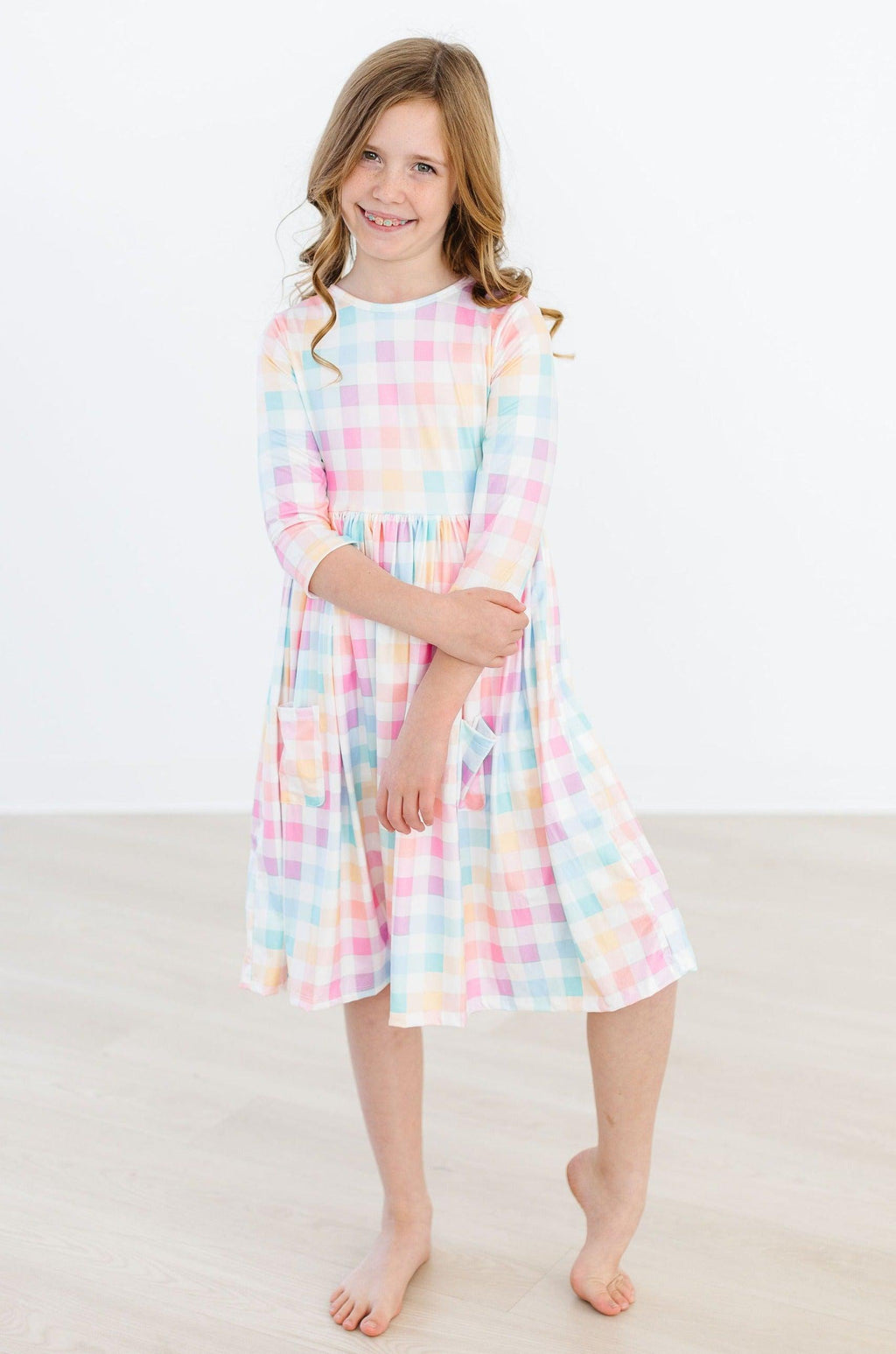 Robe virevoltante à carreaux pastel, manches 3/4 et poches