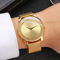 A Stylish Women'S Quartz Watch with a Mesh Strap - Featuring a Golden round Dial, Fashionable Zinc Alloy Strap and Case, a Casual Decorative Accessory, Perfect as a Ramadan Gift or a Present for Mom.